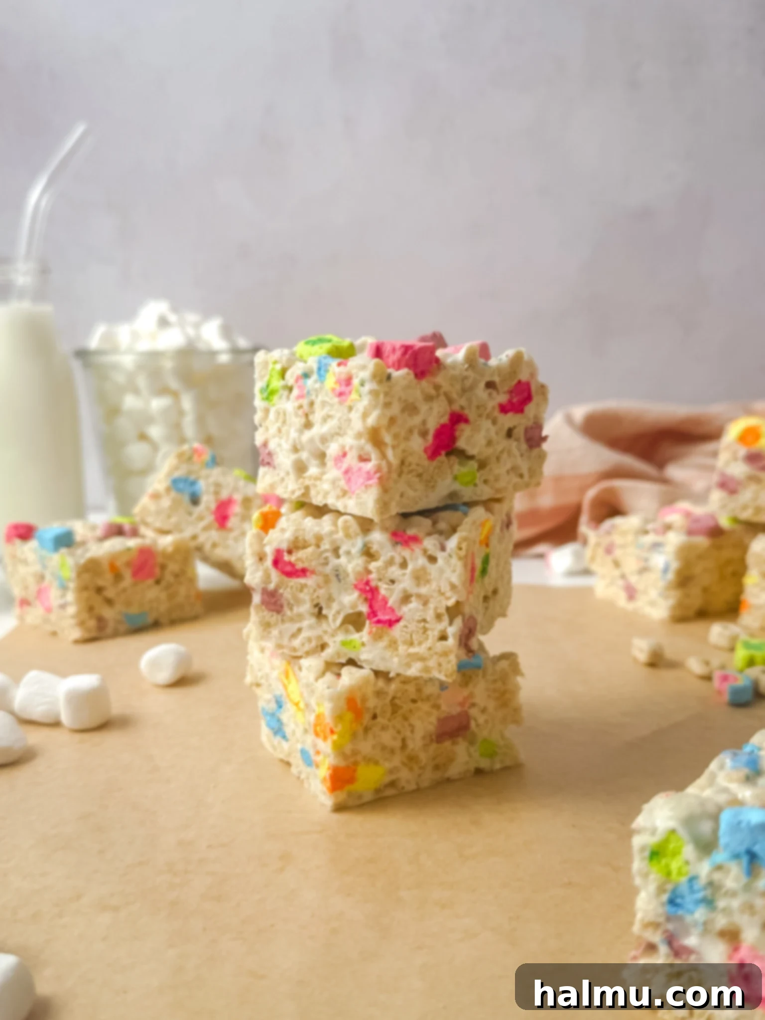 A single Lucky Charms Krispie Treat square on a plate