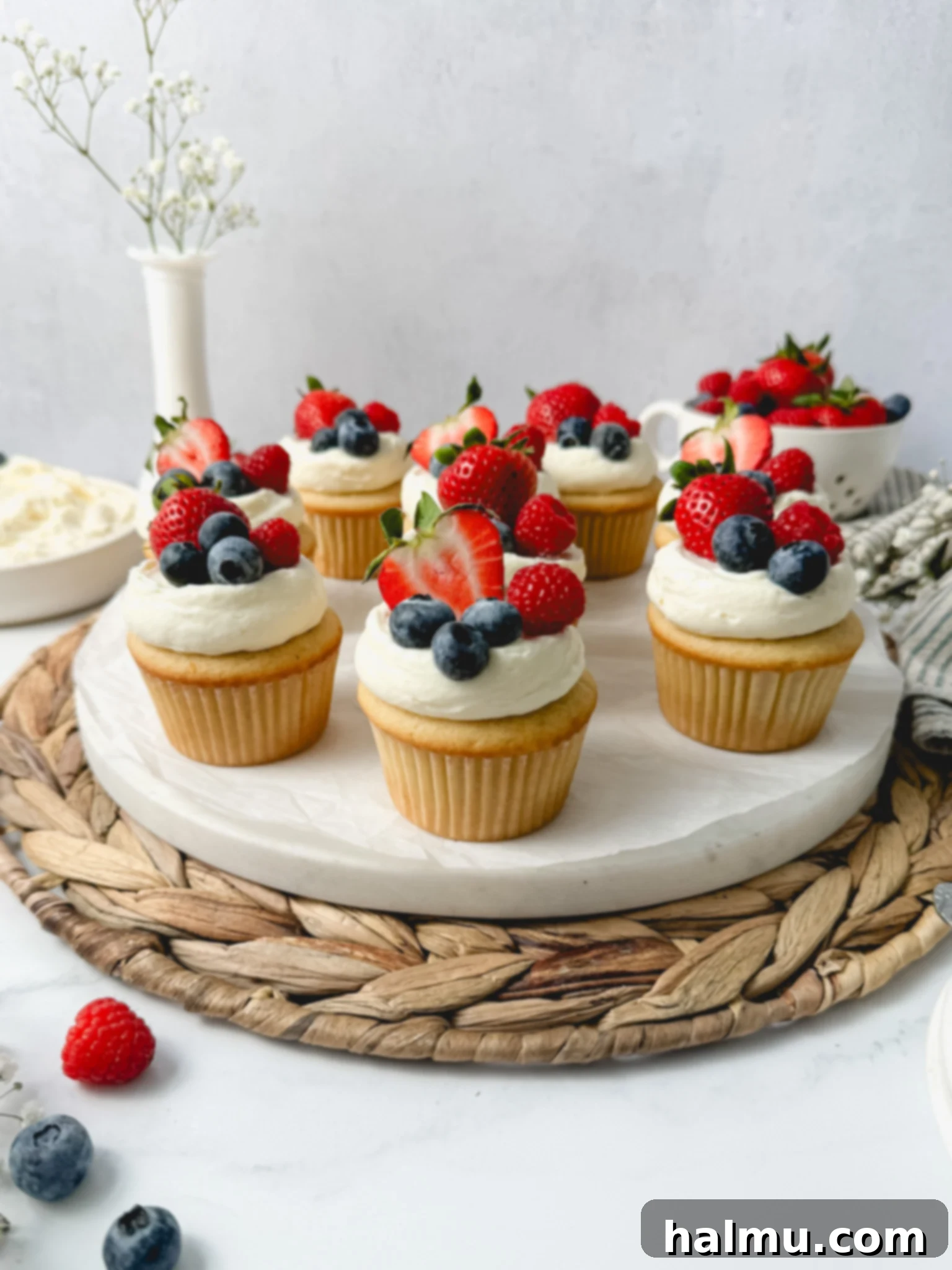 Close-up of Berry Chantilly Cupcakes being frosted with Chantilly frosting