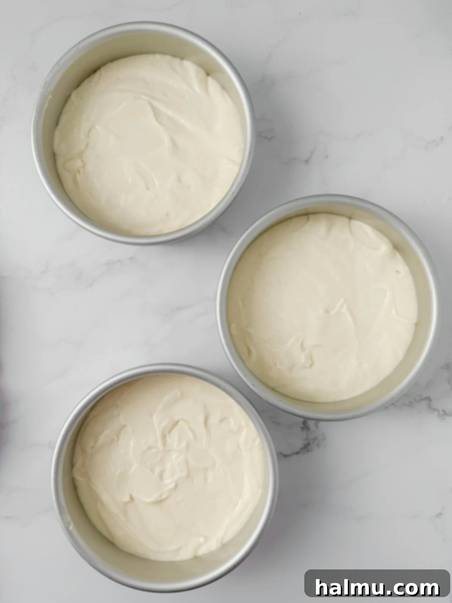 A beautifully frosted coconut layer cake, ready to be served.