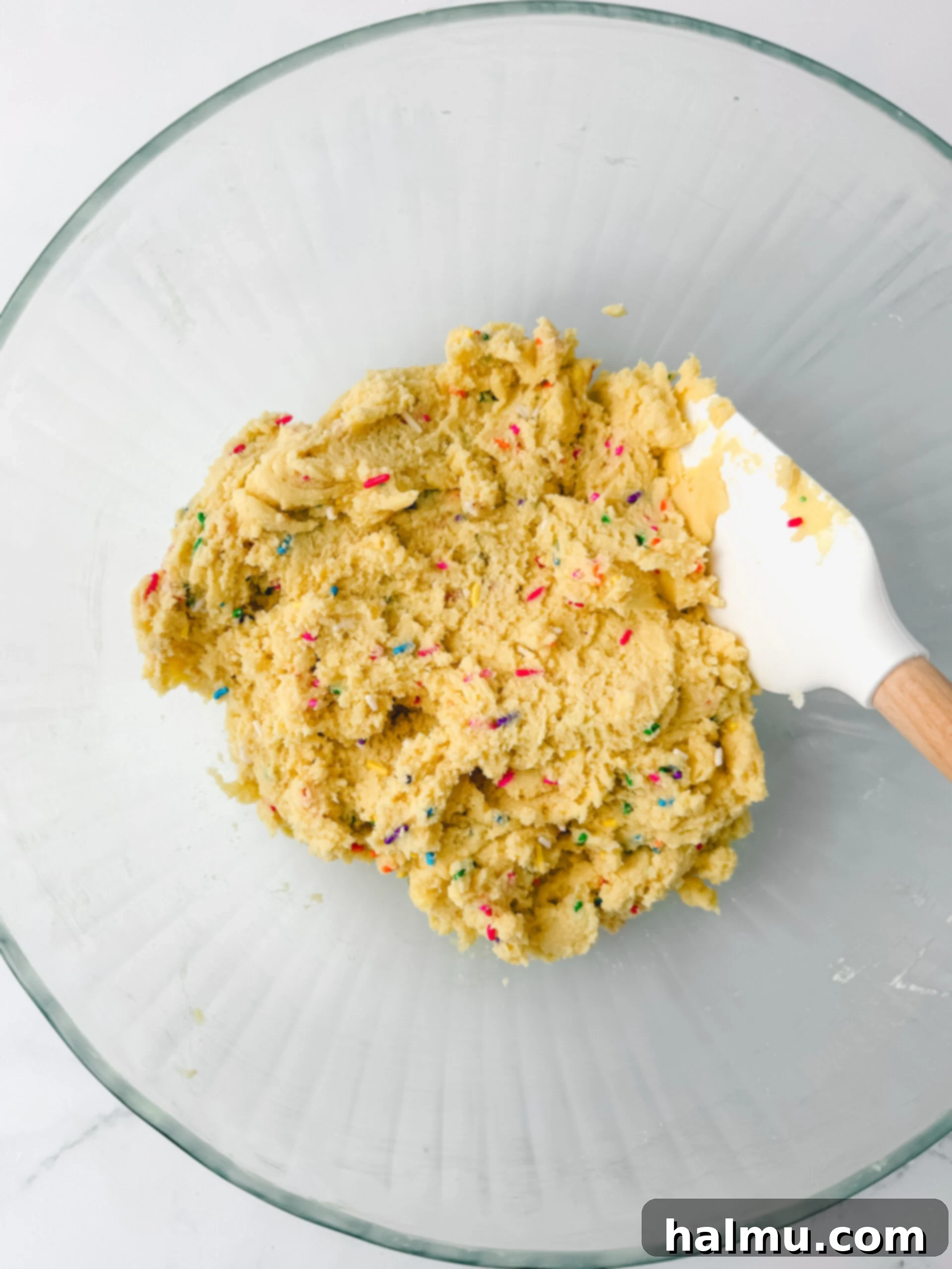Funfetti Cake Cookies 4 Cookie dough balls on a baking sheet before baking
