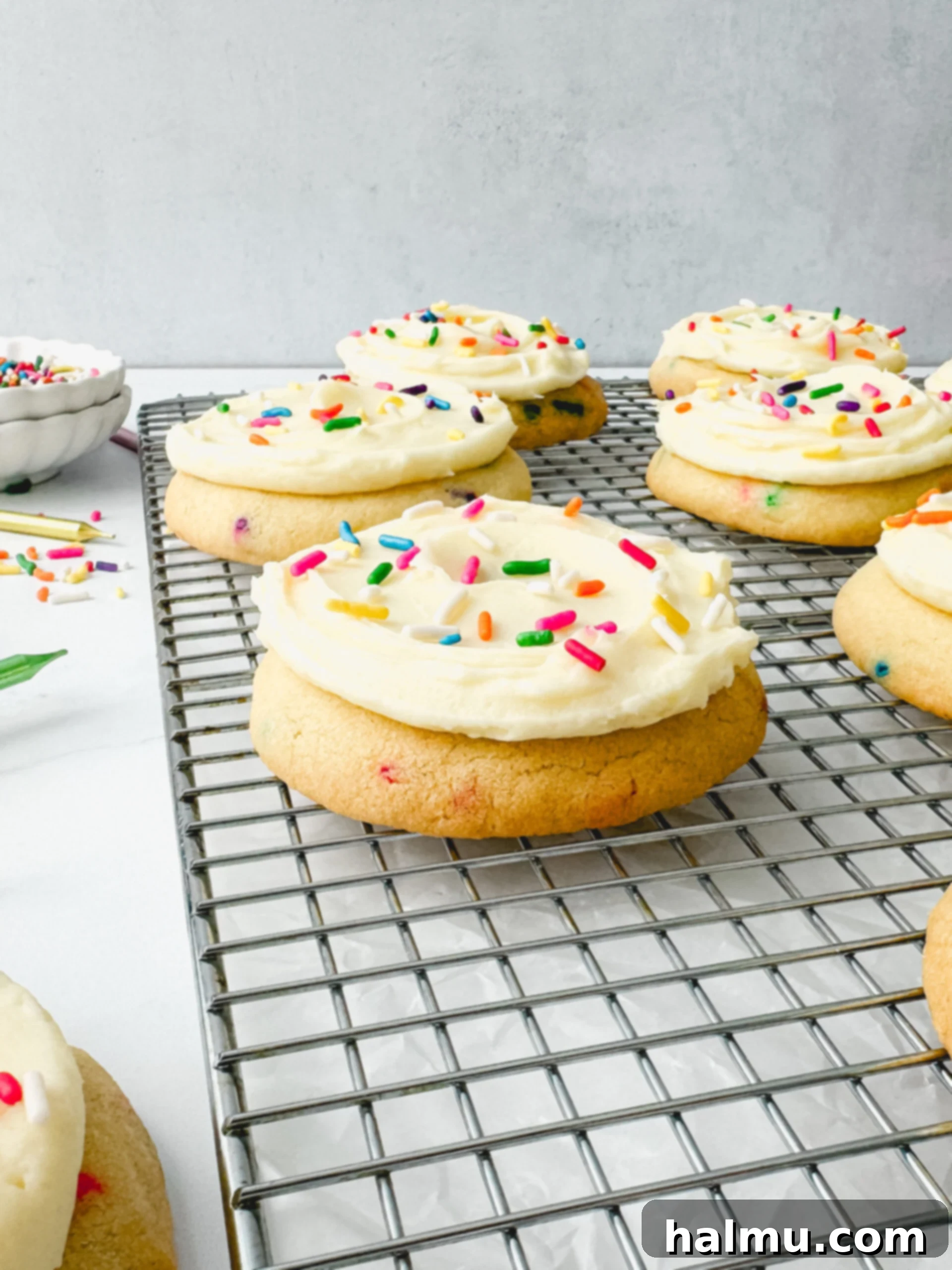 Funfetti Cake Cookies 7 Close-up of a stack of Birthday Cake Cookies with frosting and sprinkles