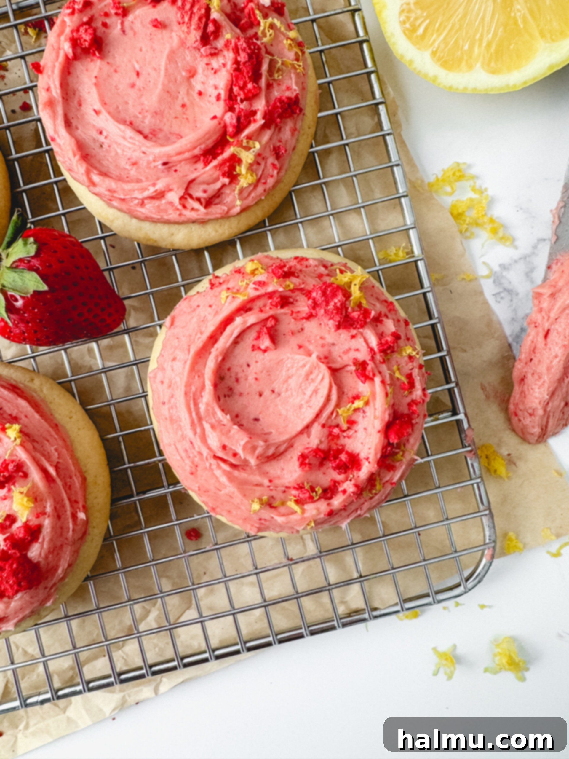 Close-up of fluffy strawberry buttercream in a mixing bowl, ready for frosting.