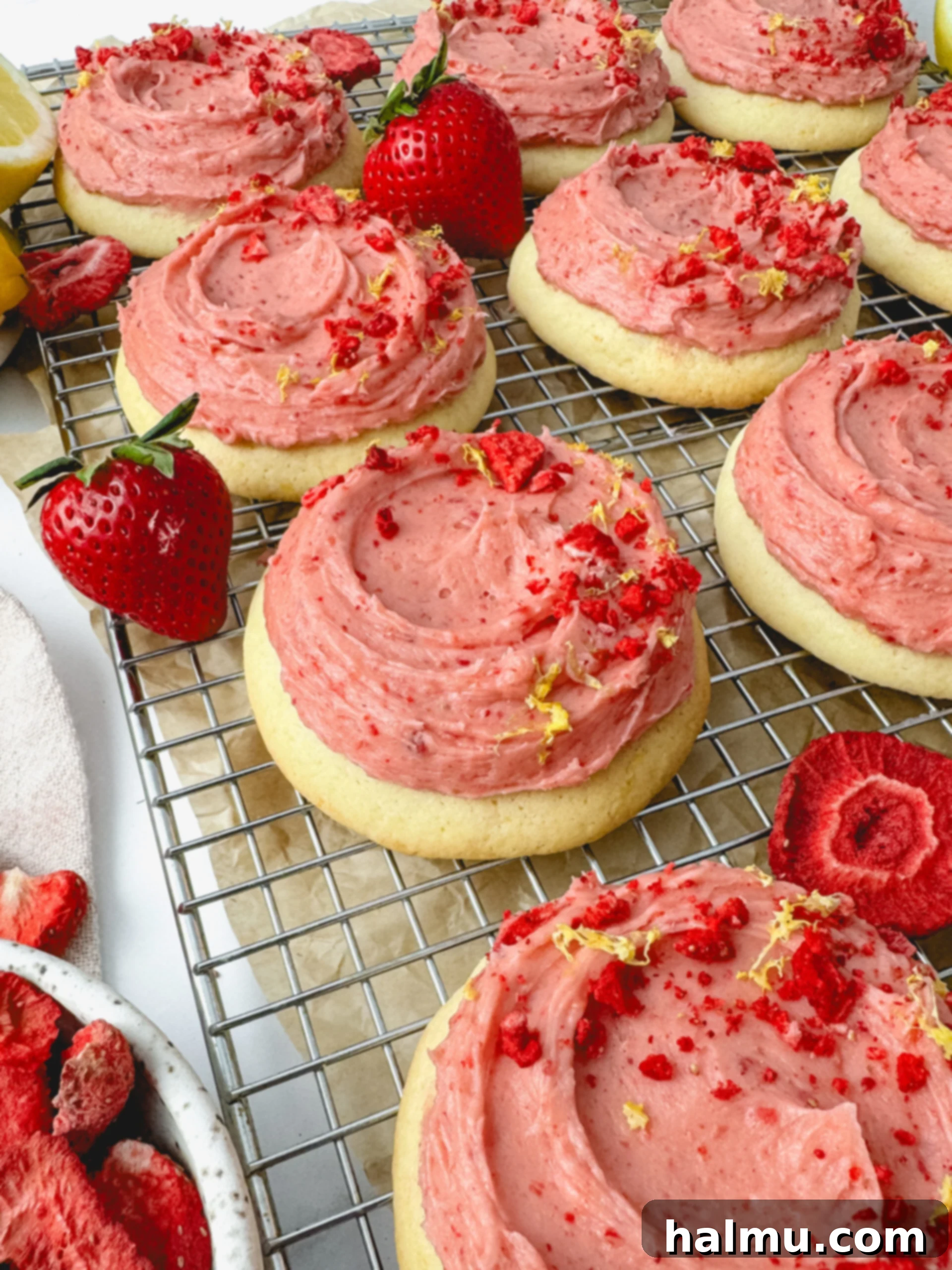 Close-up of a Strawberry Lemonade Cookie showing the thick buttercream frosting