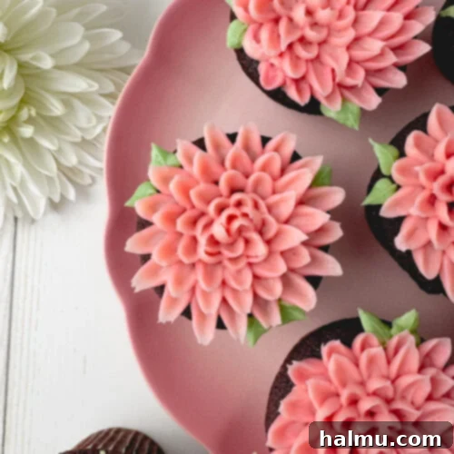 Cupcake Candles 12 A beautifully decorated chocolate mum cupcake with two-toned pink buttercream and green leaves.