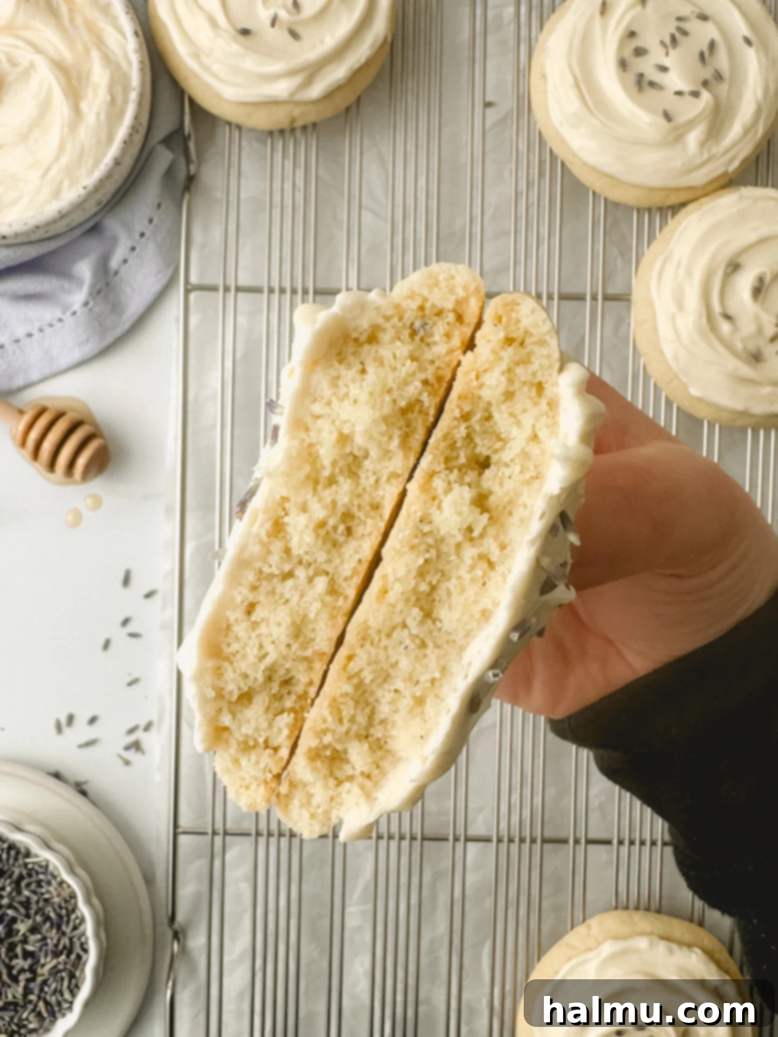 Lavender Kissed Honey Cookies 11 Close-up of a Honey Lavender Cookie cut in half, showing its soft interior.