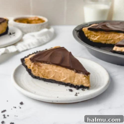 A delicious slice of Chocolate Peanut Butter Pie on a white plate