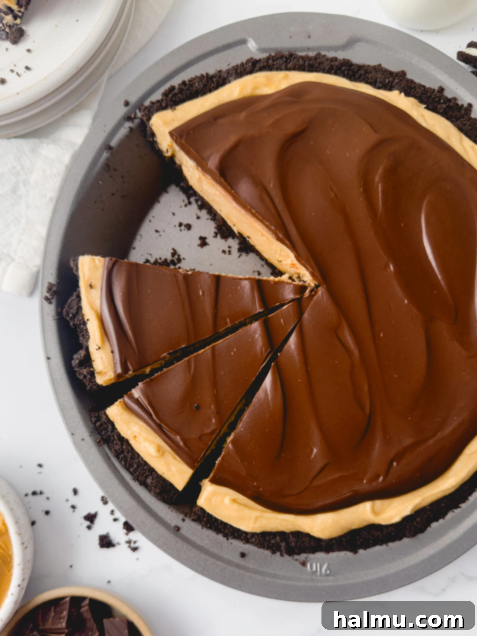 Close-up of a whole Chocolate Peanut Butter Pie, showing the smooth chocolate ganache topping