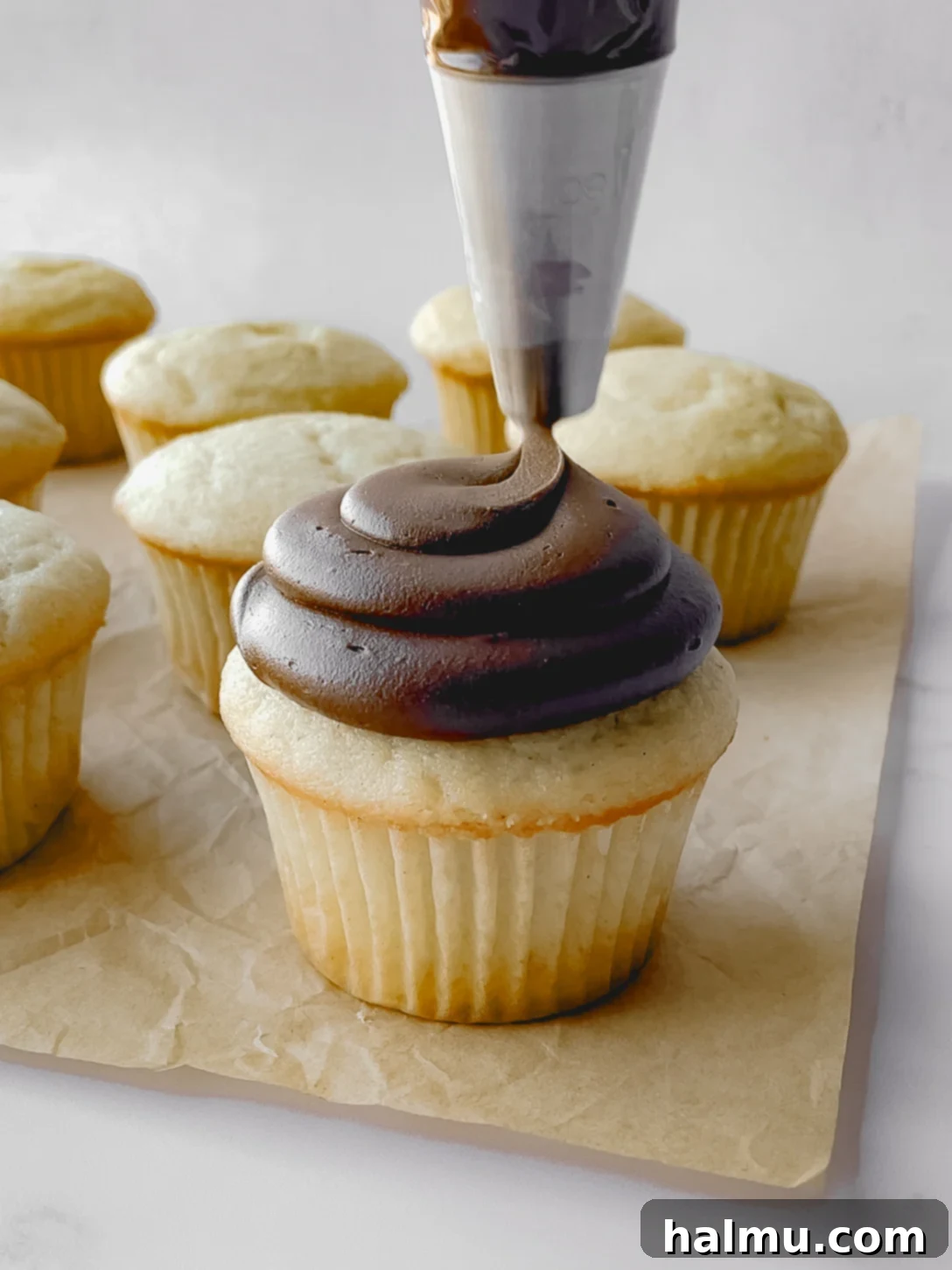 Close-up of chocolate cream cheese frosting texture, showcasing its ideal consistency.