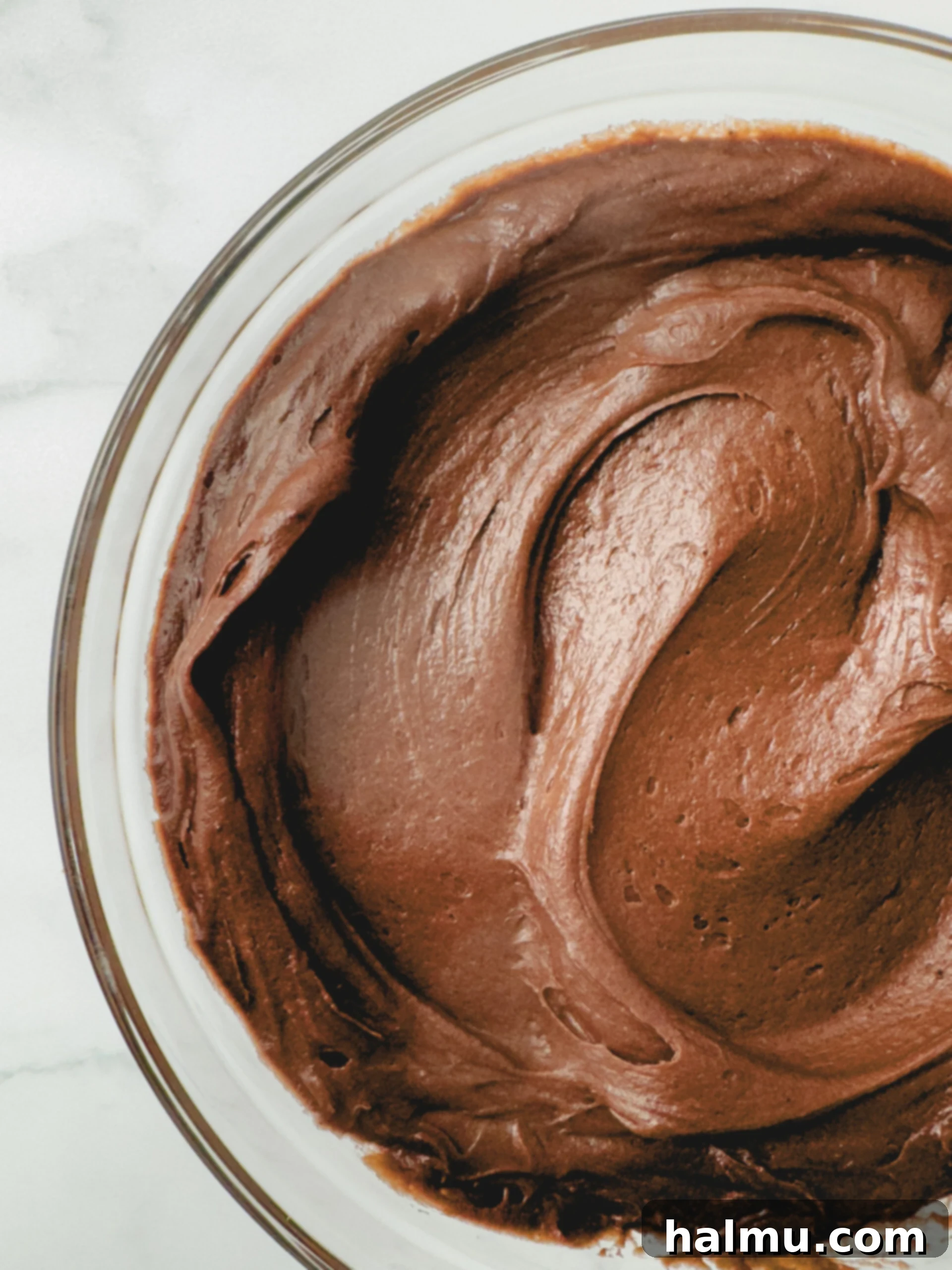 Beautifully frosted chocolate cupcakes with rich chocolate cream cheese frosting, ready to serve.