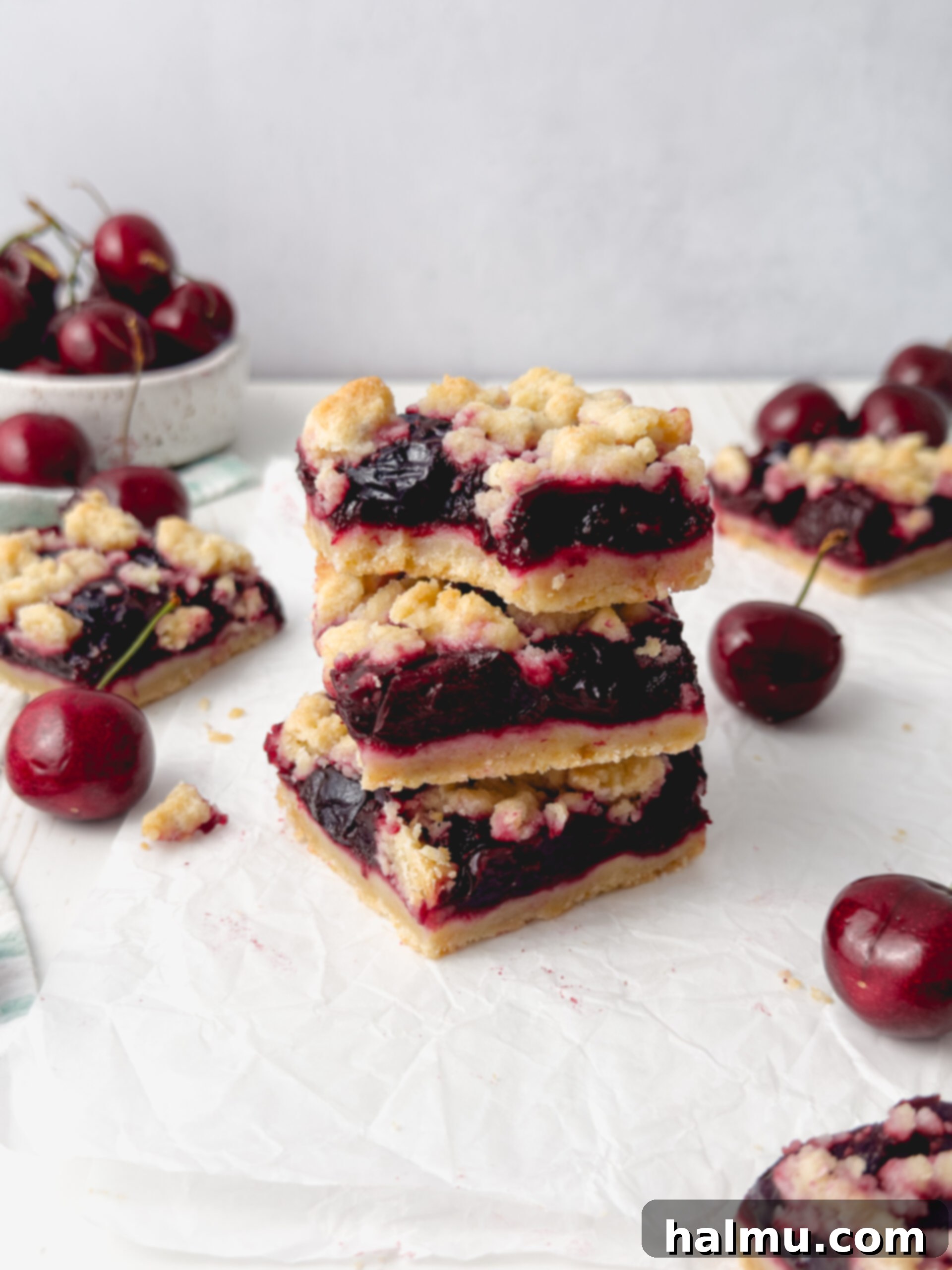 Close-up of the cherry filling simmering in a saucepan, showing its thick, glossy texture.