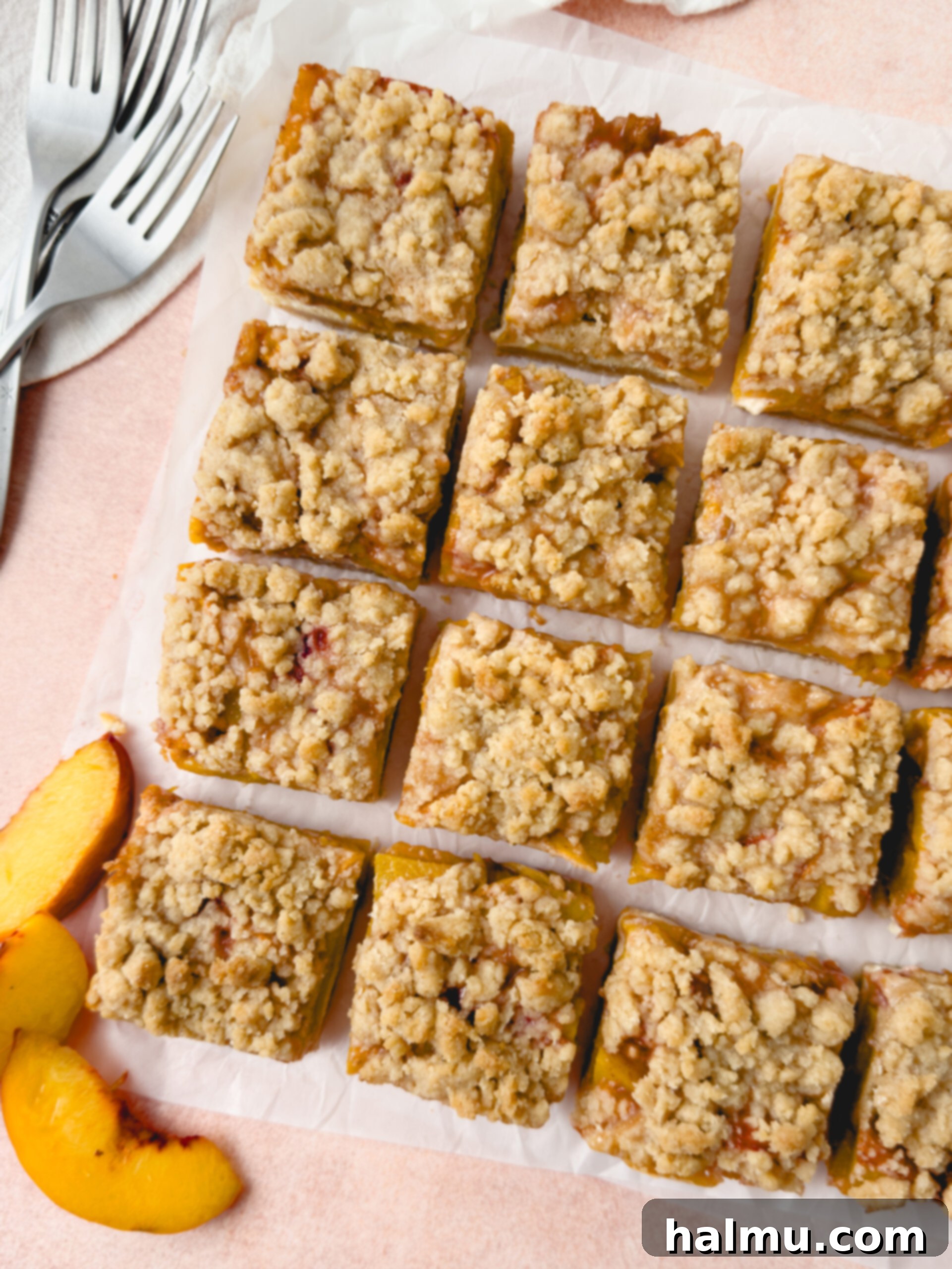Assembled Peaches and Cream Bars in a pan before baking, showing the crumble topping.