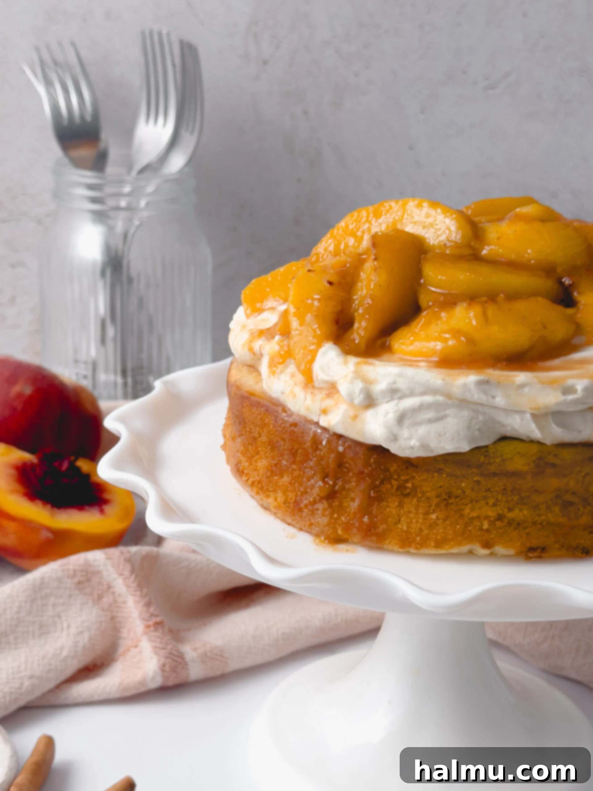 Peach Shortcake 6 Assembled Peach Shortcake Cake topped with cream and peach compote.