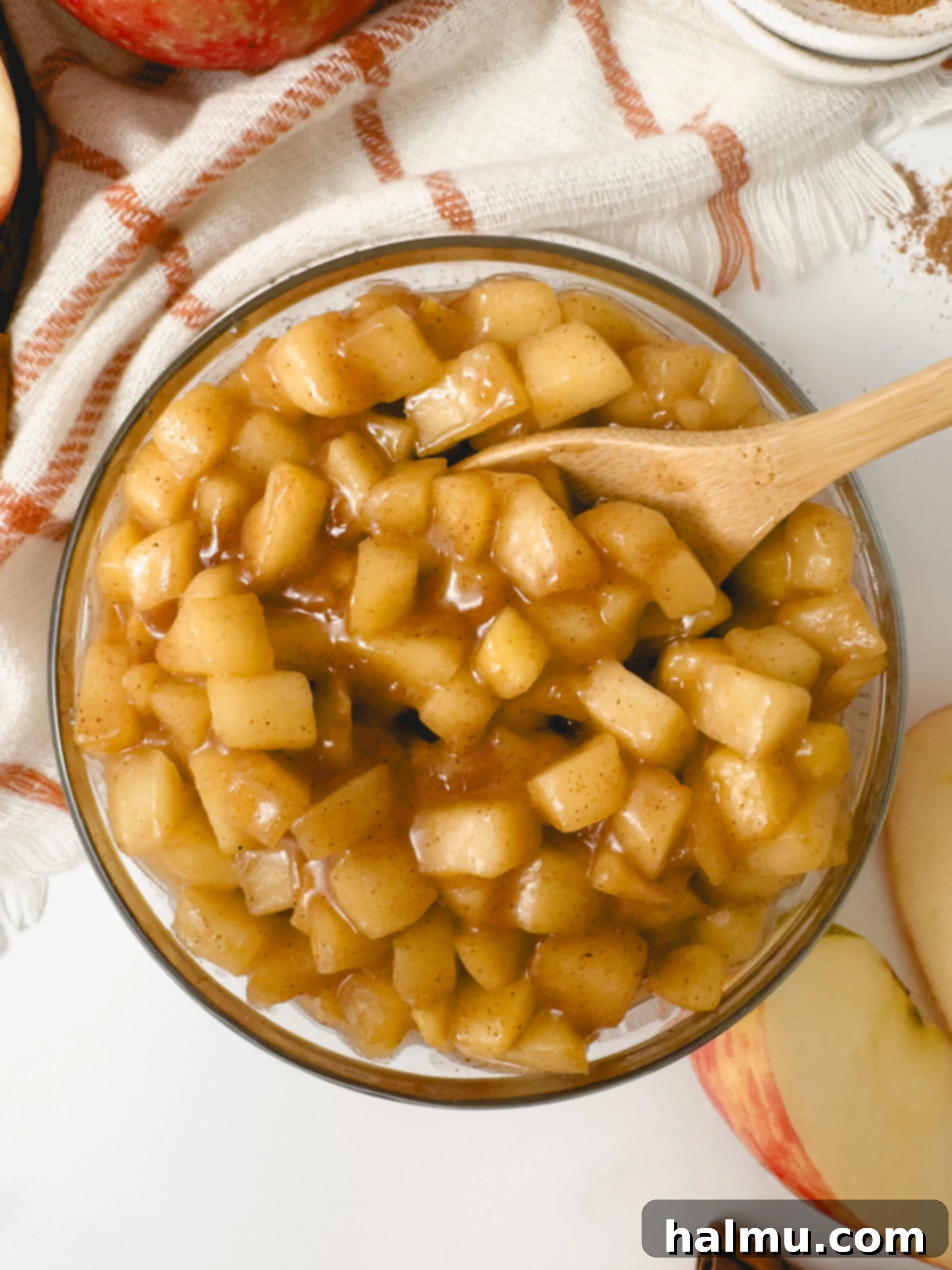 A bowl of easy apple compote garnished with cinnamon stick