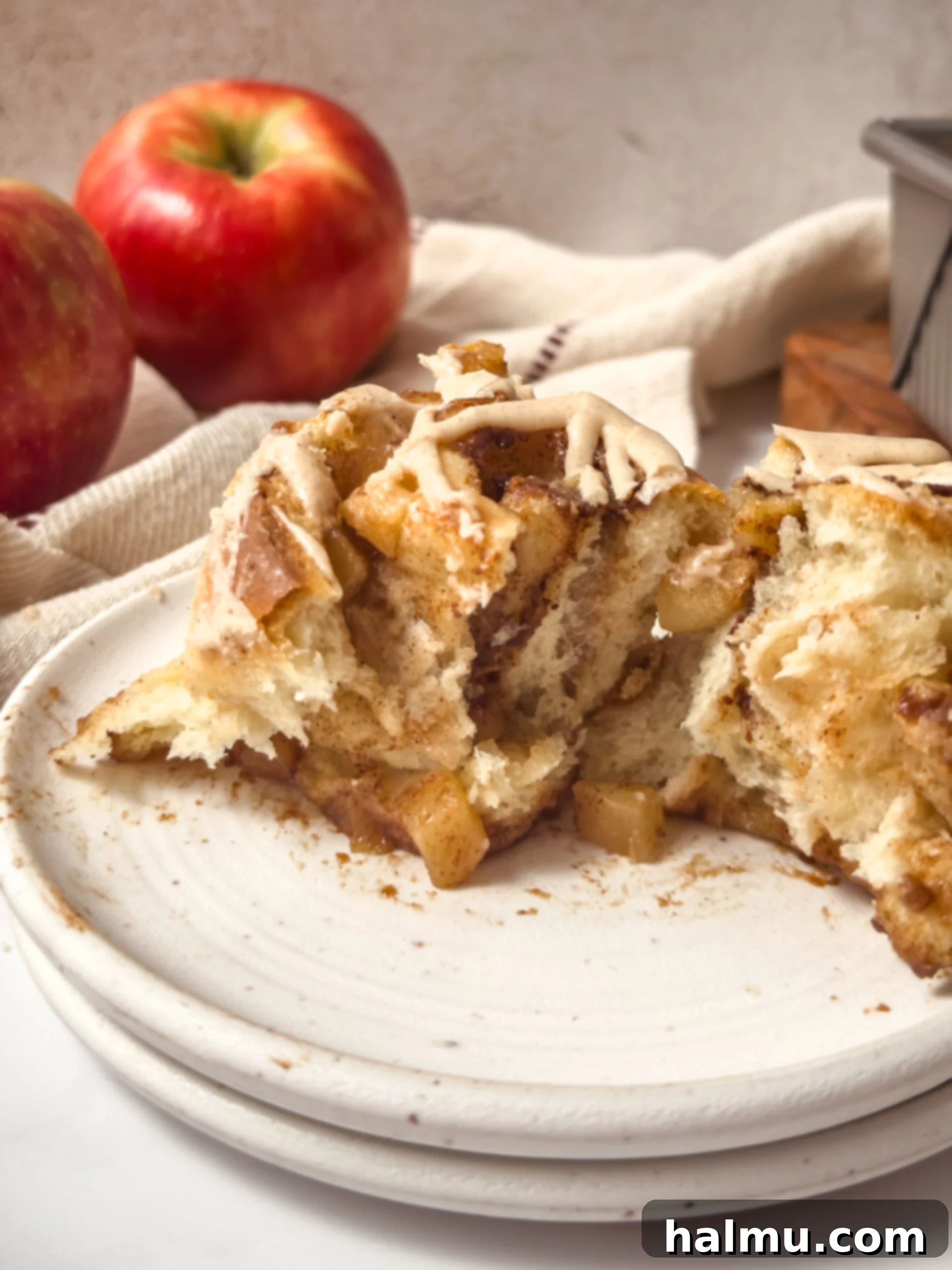 Orchard Apple Cinnamon Swirls 8 A tray of freshly baked and glazed apple pie cinnamon rolls