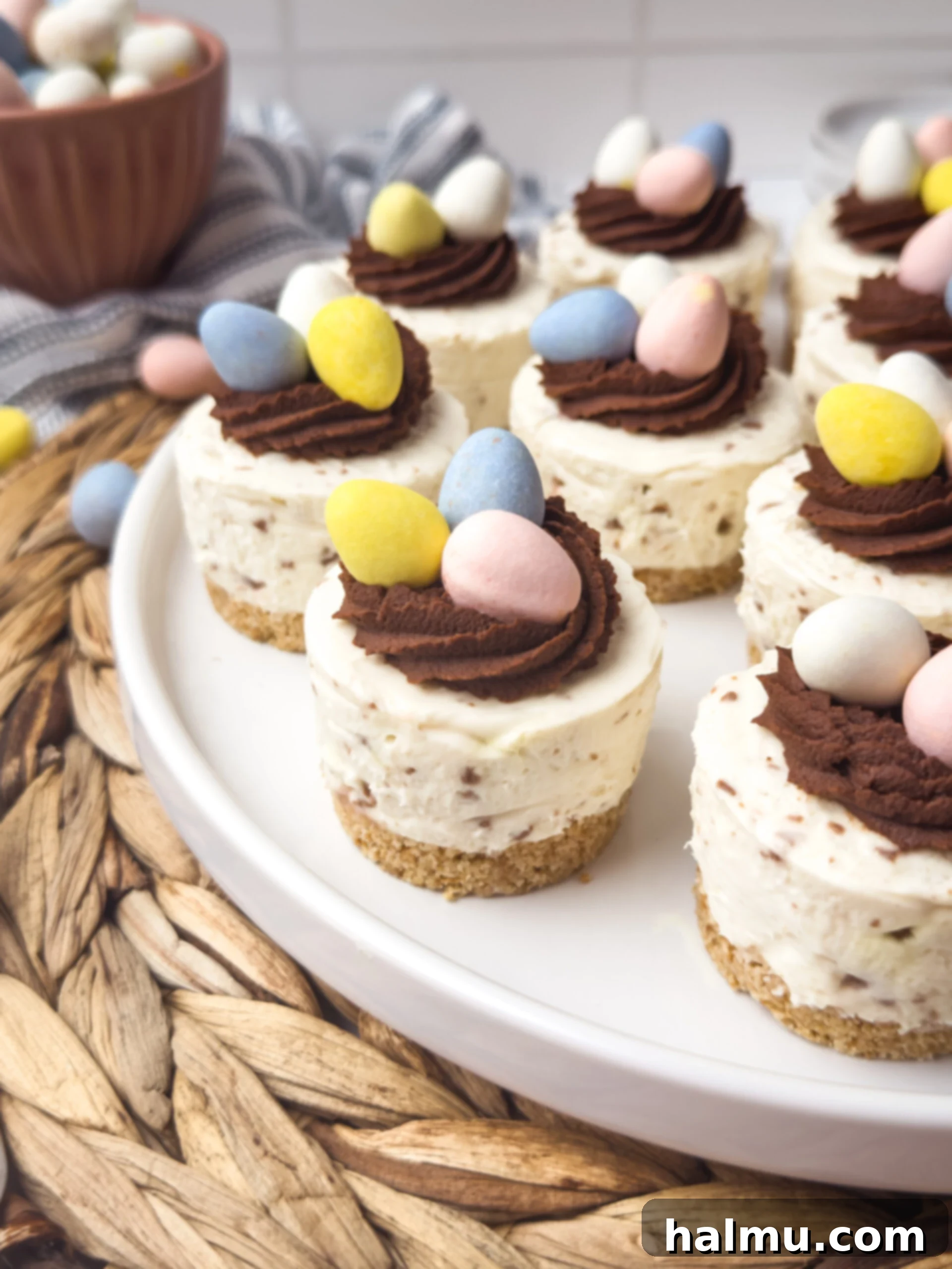 Easter Mini Egg Cheesecake Bites 2 Mini Egg Cheesecakes decorated with chocolate ganache and mini eggs