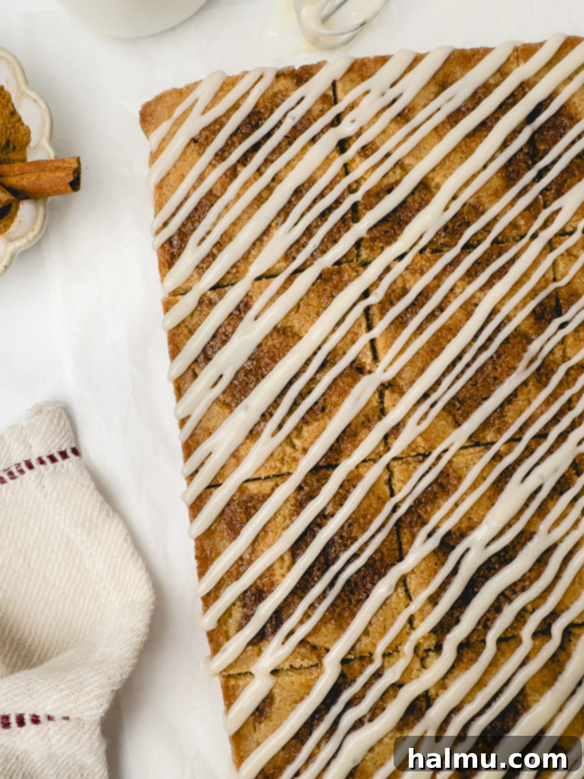 Sweet Cinnamon Swirl Blondies 5 Plated Cinnamon Roll Blondies with white glaze