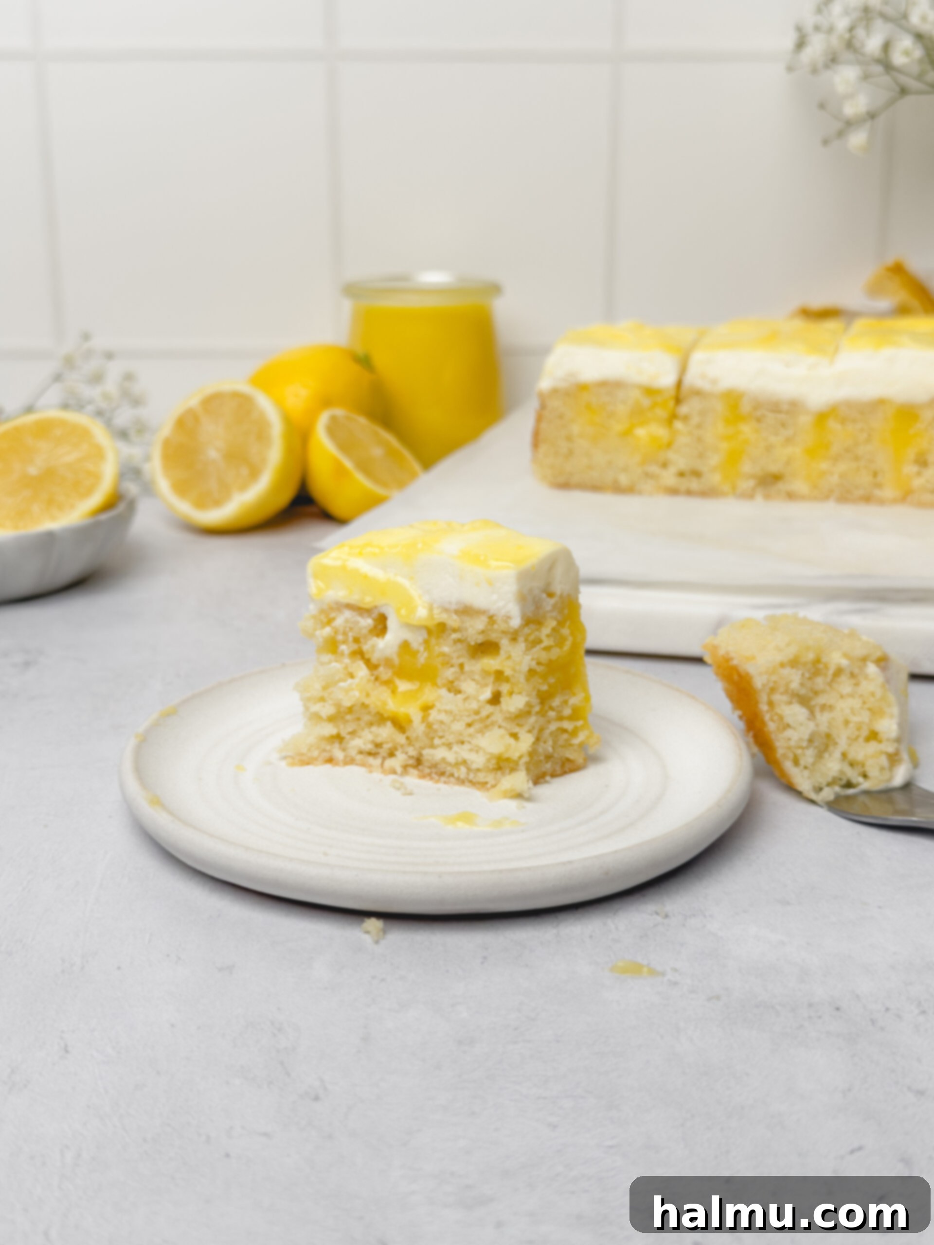 A top-down view of the Lemon Curd Cake, showing the decorative swirls of curd in the frosting.