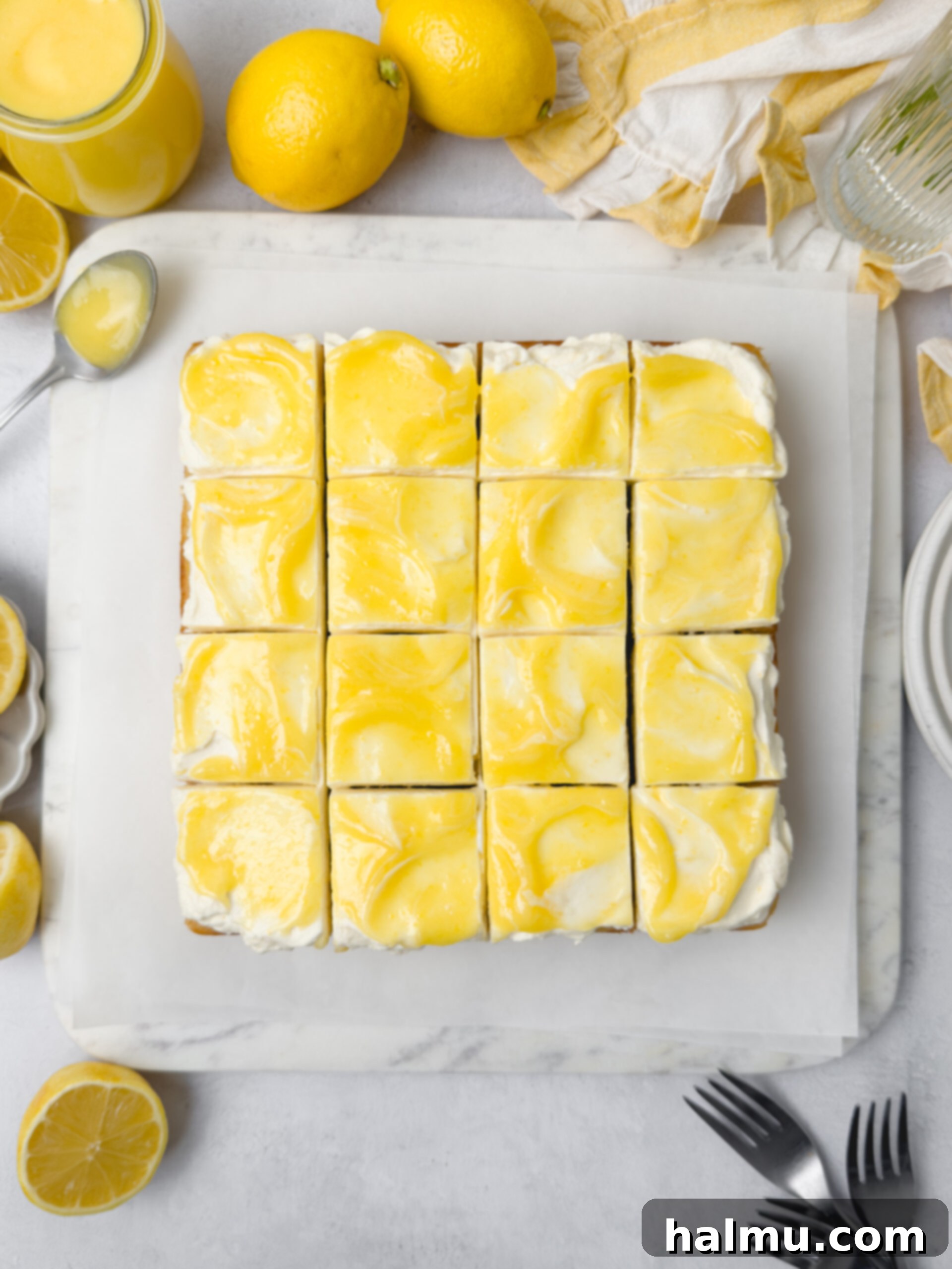 Close-up of the Lemon Curd Cake, showing the whipped cream frosting and a hint of the lemon curd filling.