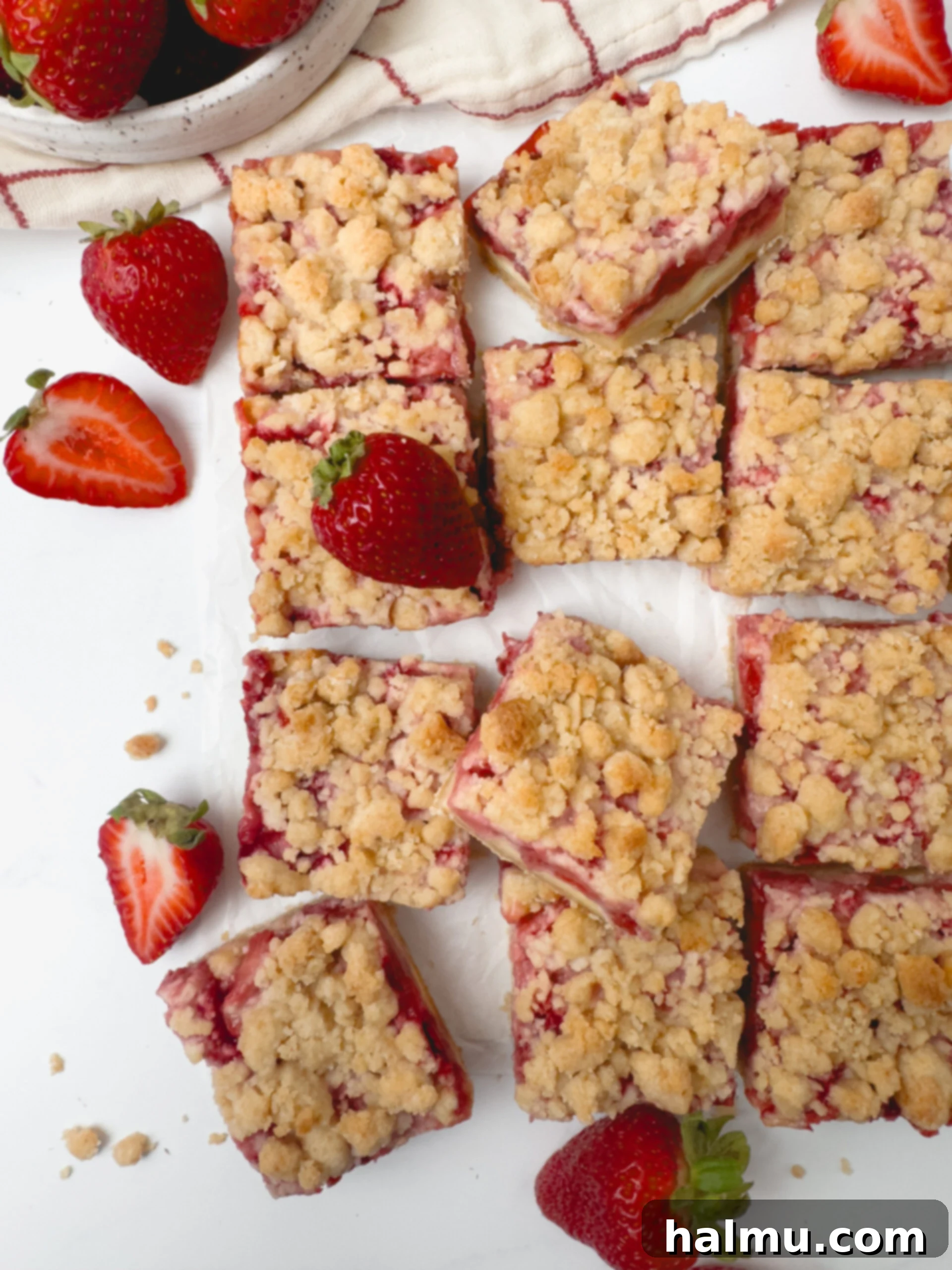 Delicious Strawberry Crumb Bars with a creamy vanilla layer and buttery crumble topping.