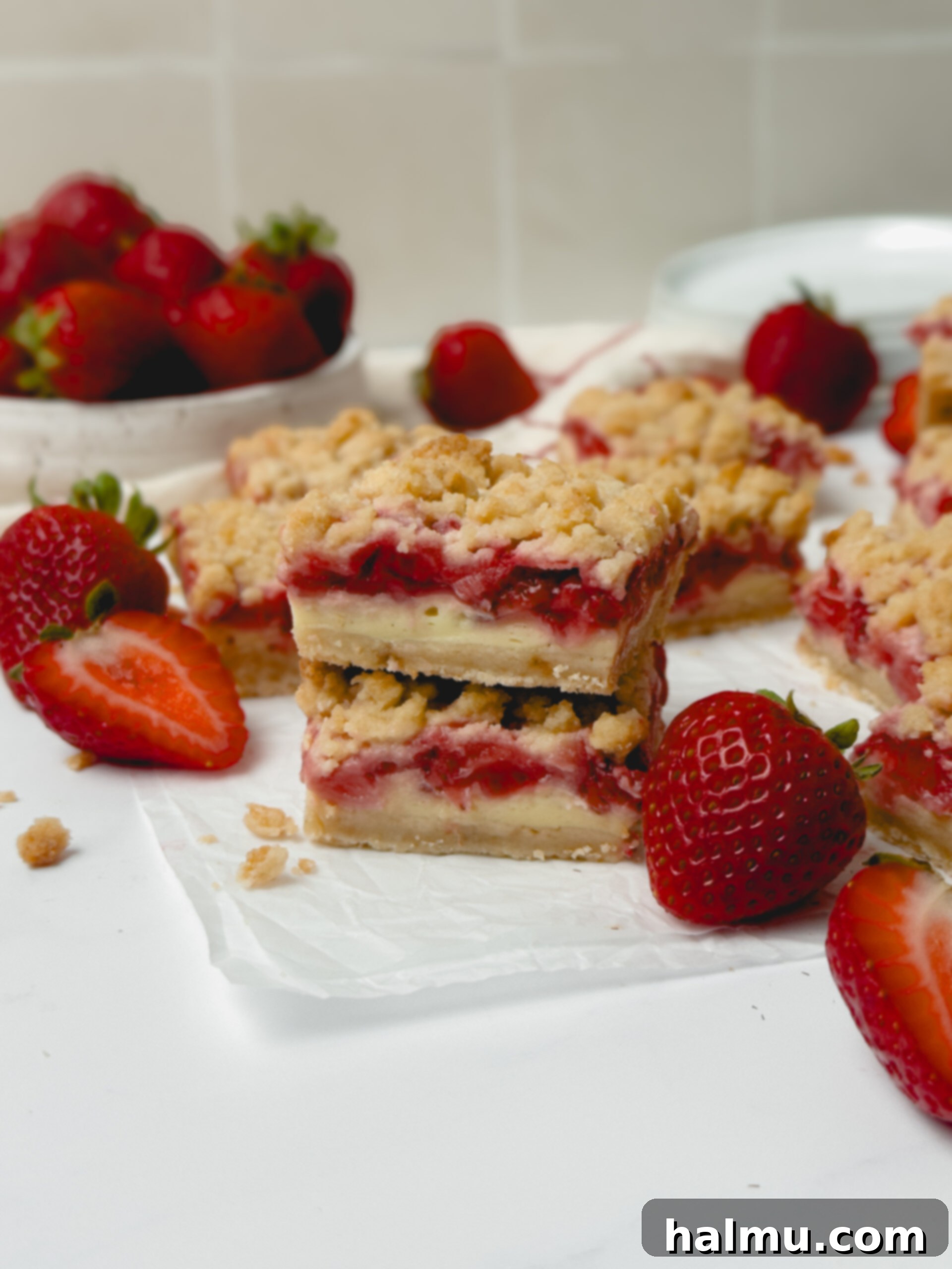 A stack of Strawberry Crumb Bars on a serving plate.