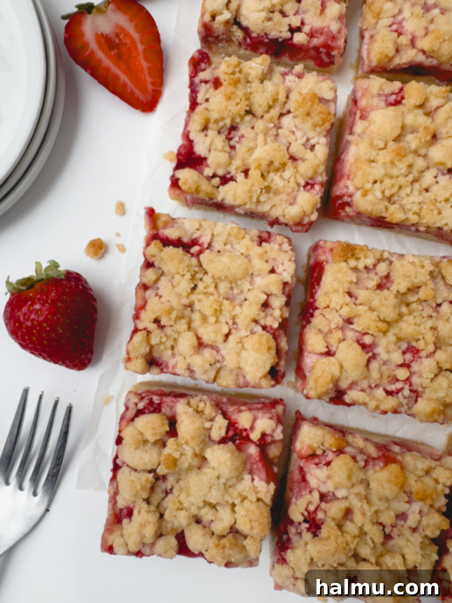 Close-up of a perfectly sliced Strawberry Crumb Bar, showcasing all the delicious layers.