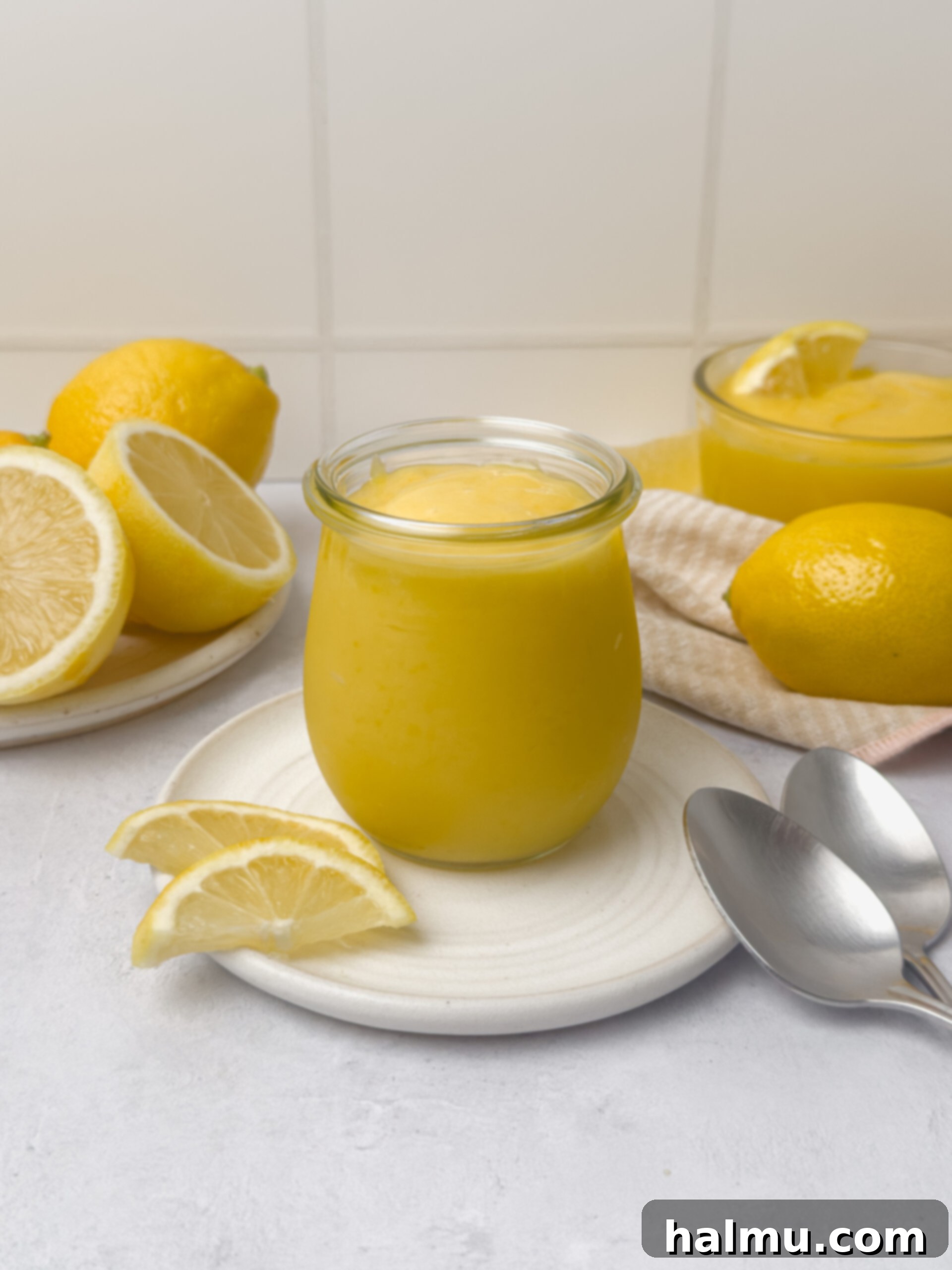 Zesty Lemon Cream 6 A close-up of a kitchen scale with lemons, emphasizing precise measurements for baking.