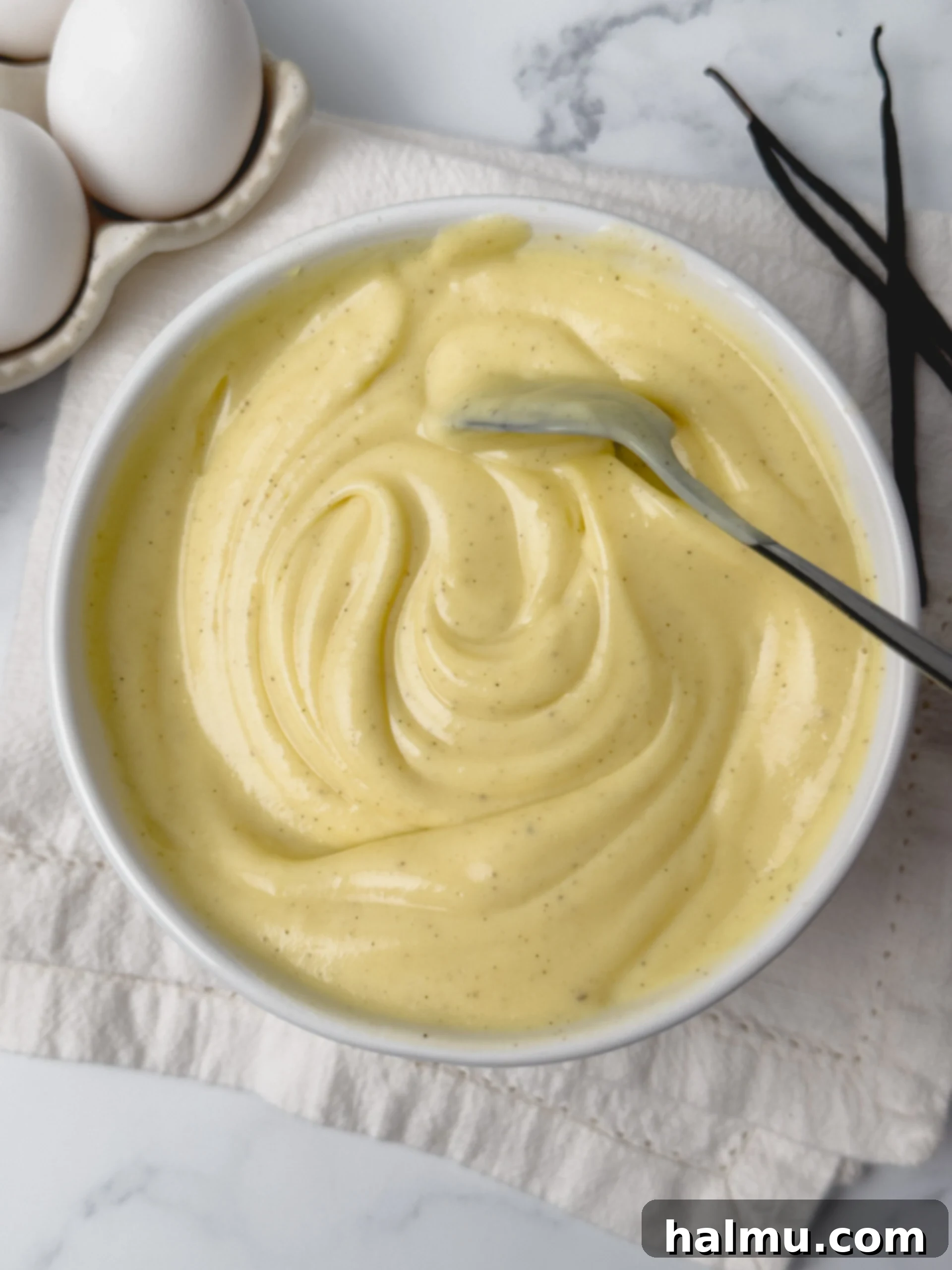 Velvety Vanilla Dream 2 Delicious, creamy Vanilla Pastry Cream in a bowl, ready to be used in various desserts.
