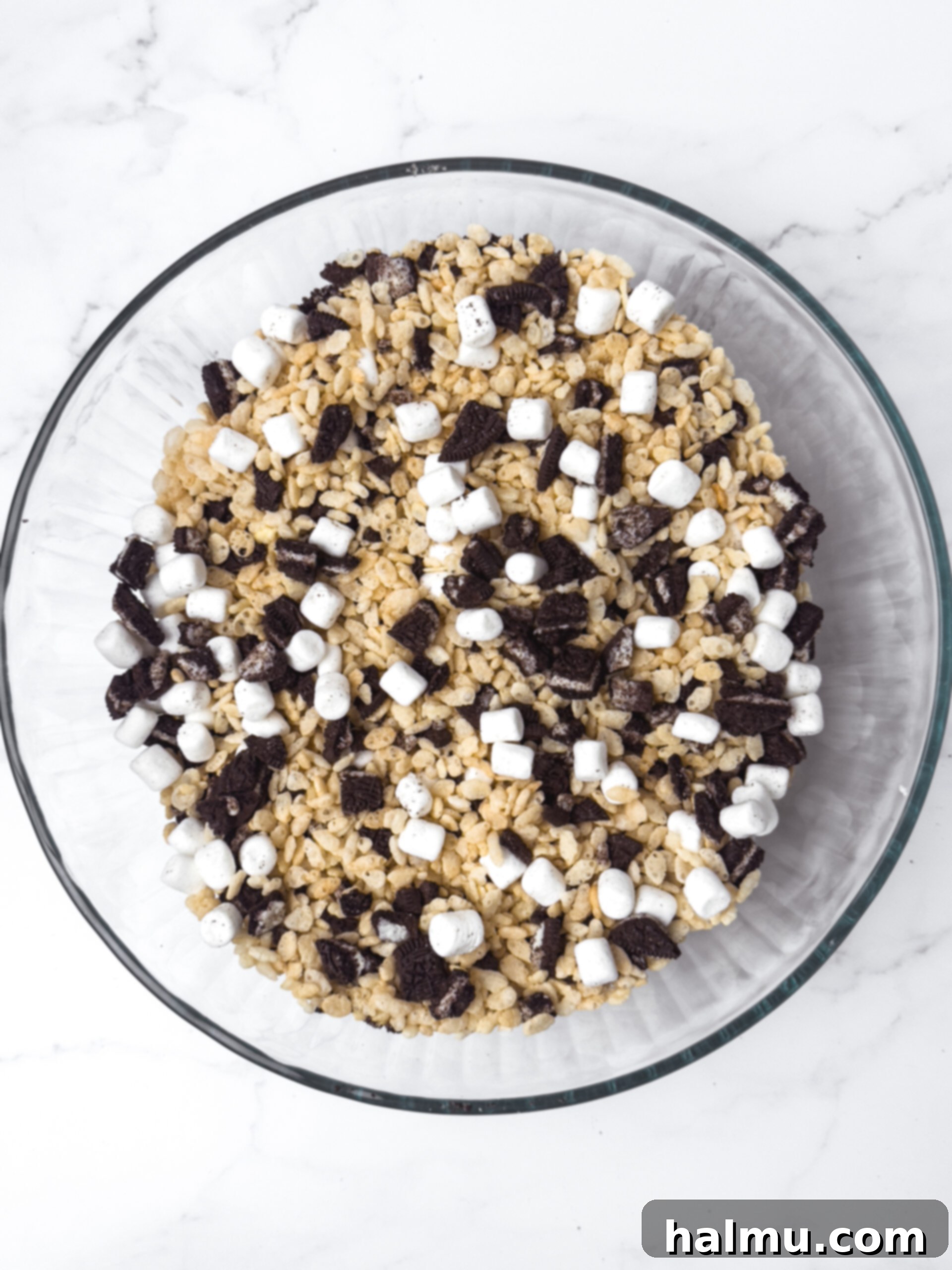 Oreo Krispie Treats 4 Ingredients mixed in a bowl: rice cereal, chopped Oreos, and mini marshmallows.