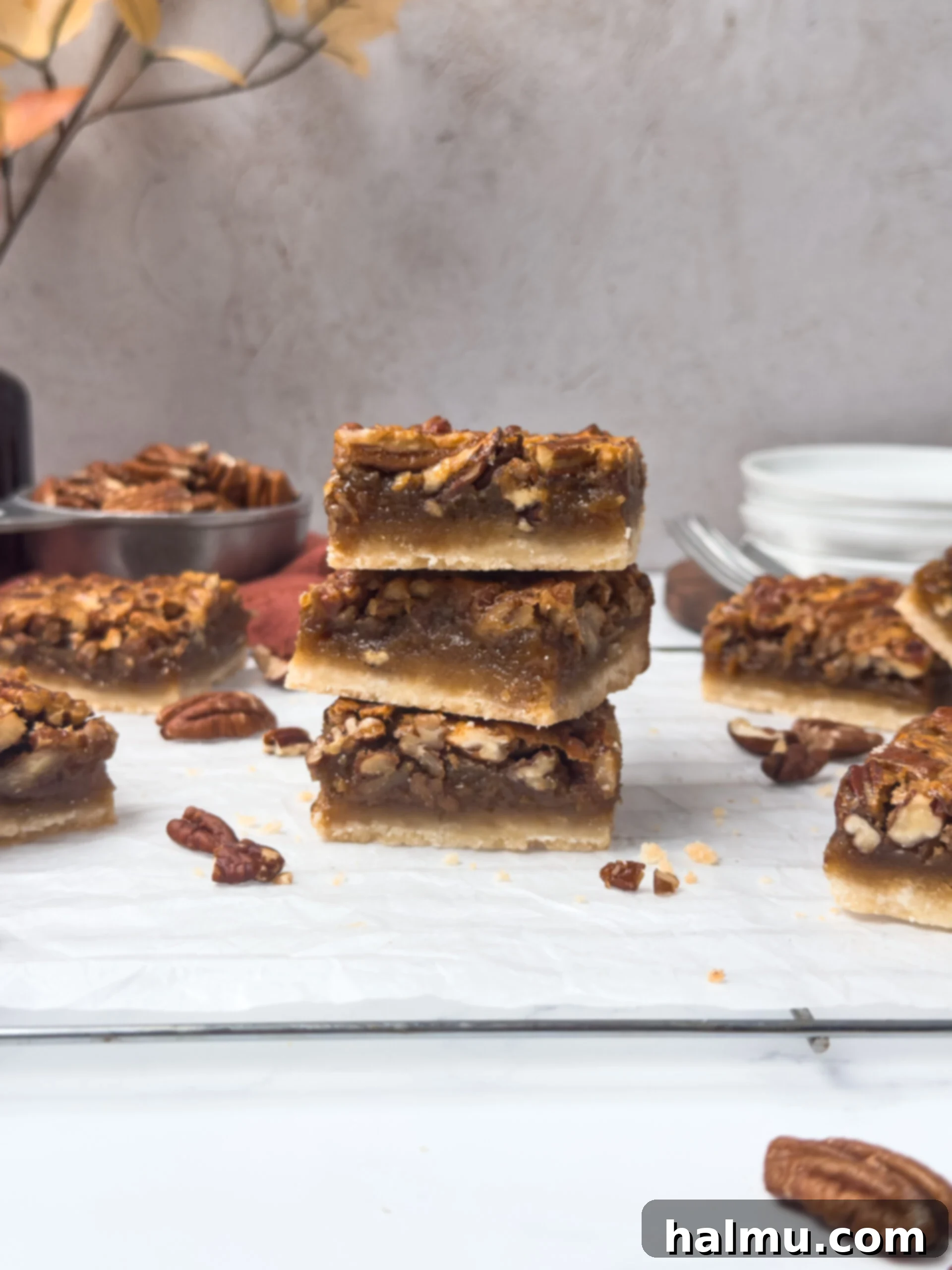 Preparing the shortbread crust for pecan pie bars in a baking pan.