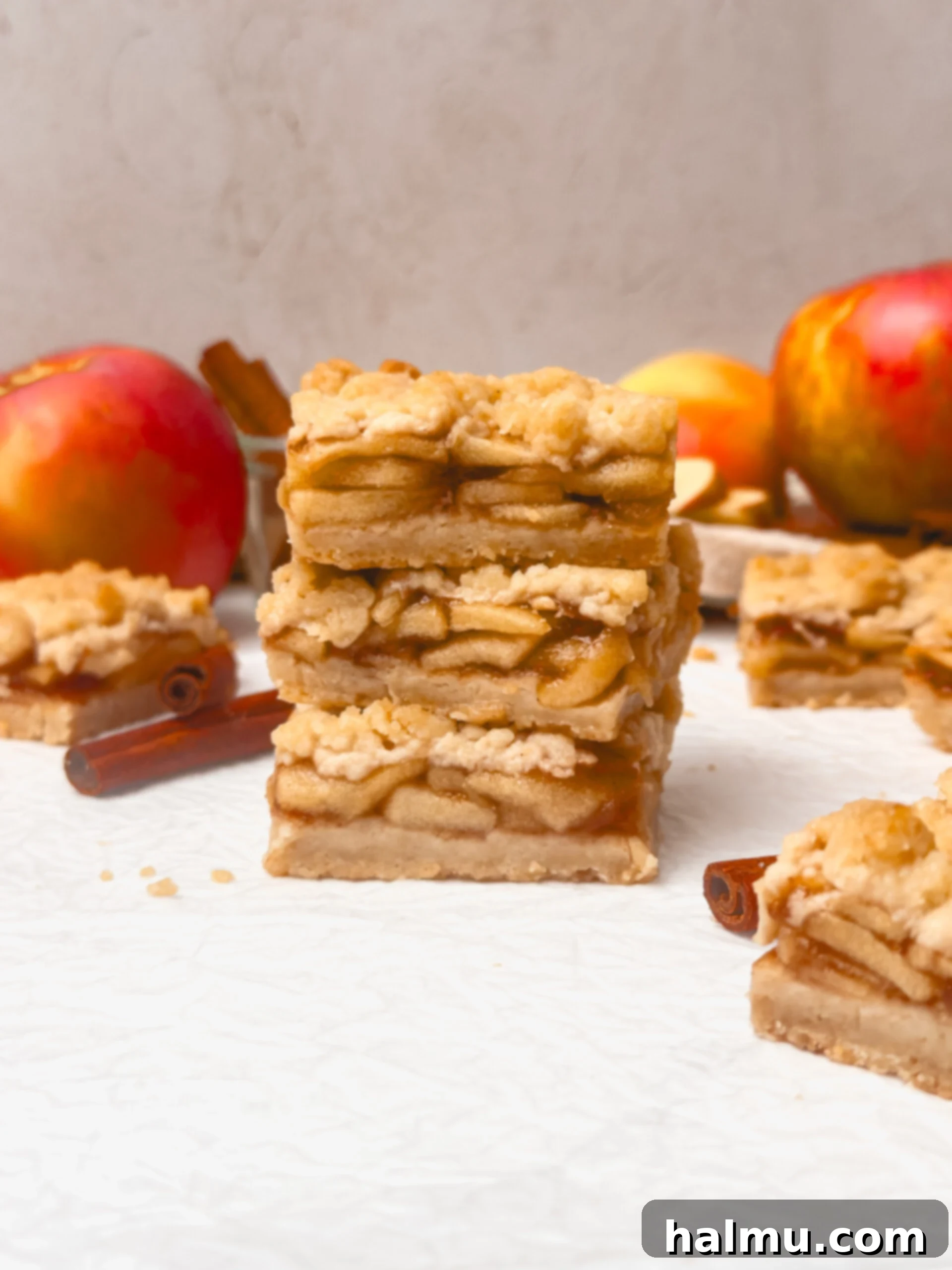 Close-up of a single apple pie bar slice with layers visible