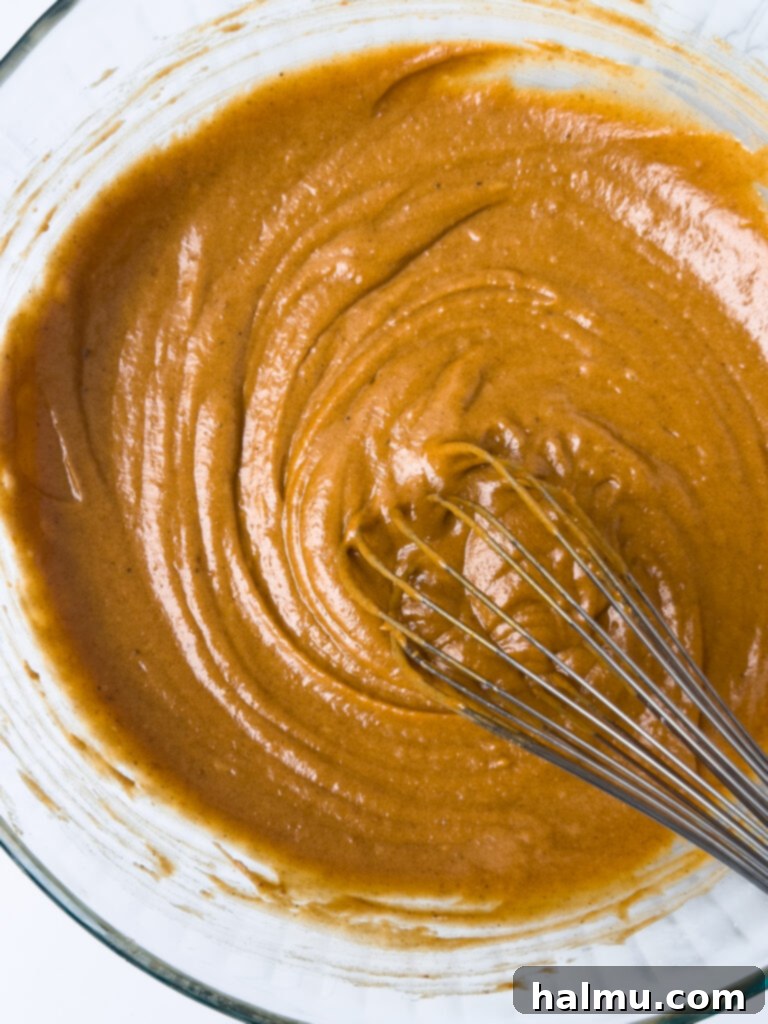 Pumpkin Cupcakes with Cream Cheese Swirl 5 Mixing Pumpkin Cupcake Batter