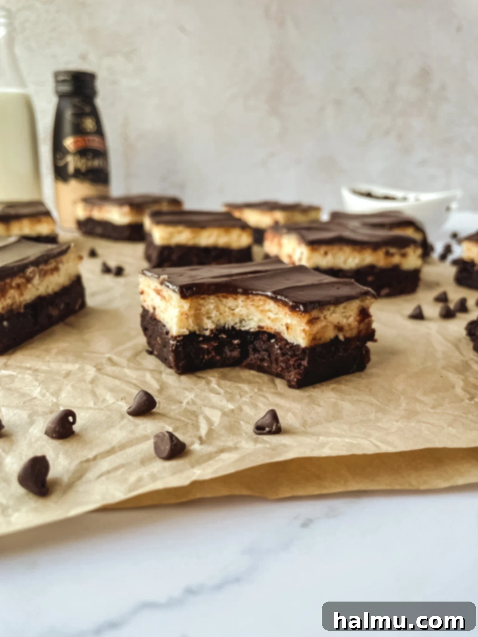 Decadent Baileys Irish Cream Cheesecake Brownies on a white platter